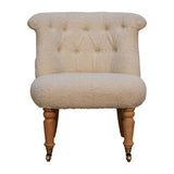 Hand-crafted mango wood accent chair in cream with handwoven cotton upholstery and caster legs