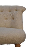 Cream accent chair featuring handwoven cotton upholstery and solid mango wood frame with oak-ish finish