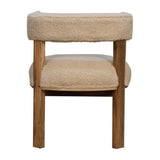 A boucle fabric chair with a soft and warm appearance and a wooden frame and legs in a natural tone