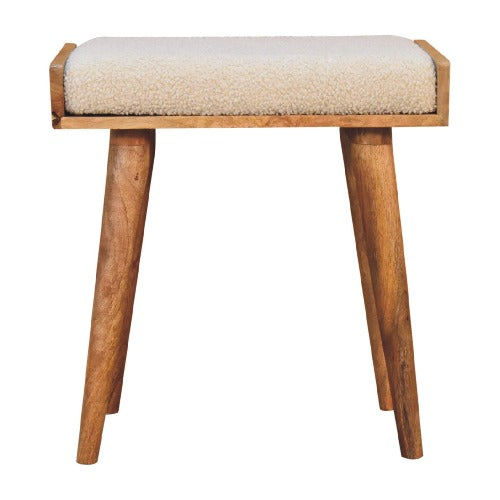 The Boucle Cream Tray Style Footstool, doubling as a comfortable and stylish seat in any interior