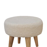 Detailed shot of the plush cushioned top, providing a comfortable resting place on the Boucle Cream Petite Footstool