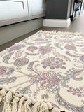 Soft and durable Paisley Rug in blue and pink with tassels, perfect for any room decor