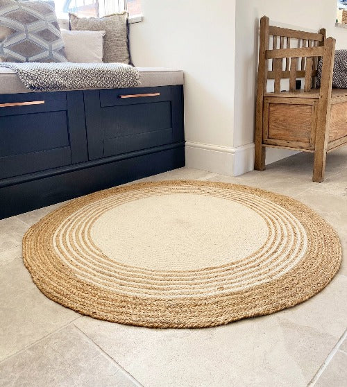 Round cotton braided rug in natural earthy colours, perfect for bohemian and rustic decor styles