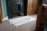 Set of 2 elegant white rugs with female silhouette prints and tassels, crafted from soft natural cotton