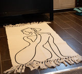 Natural cotton rugs in white with beautiful female silhouette designs, perfect for enhancing any room's ambiance