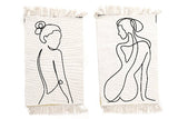 Two white cotton rugs adorned with graceful female silhouette patterns and delicate tassels, measuring L90 x W60cm